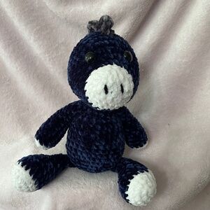 crocheted dark blue dinosaur